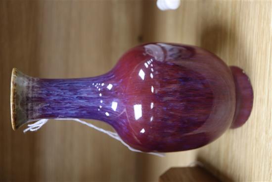 A Chinese sang-de-boeuf bottle vase, Qianlong seal mark, repair H.22cm